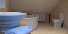 Sink, bath and toilet in loft conversion bathroom